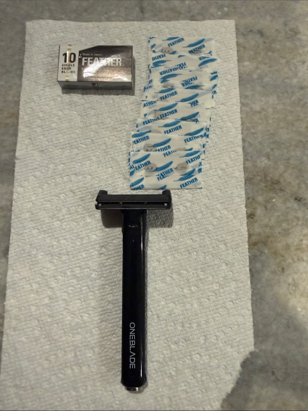 Black OneBlade Core Safety Razor with 18 Feather Blades